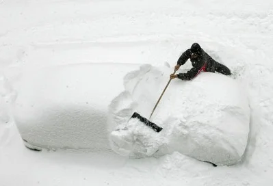 CarCoveredWithSnow.webp