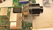 Tape holding the lens.webp